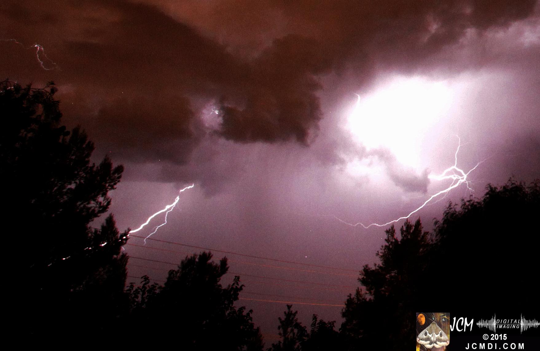 A lightning flash illuminates the night sky over Santa Clarita, Oct. 14, 2015 JCMDI.COM
